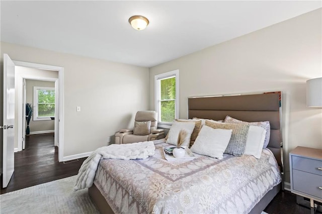 629 Dunton Cir SE, Smyrna, GA 30082 - bedroom featuring dark wood finished floors and baseboards