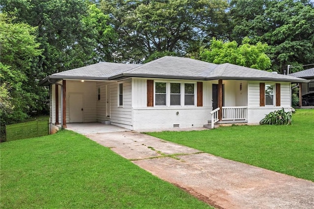 629 Dunton Cir SE, Smyrna, GA 30082 - view of front facade featuring driveway, an attached carport, crawl space, brick siding, and roof with shingles
