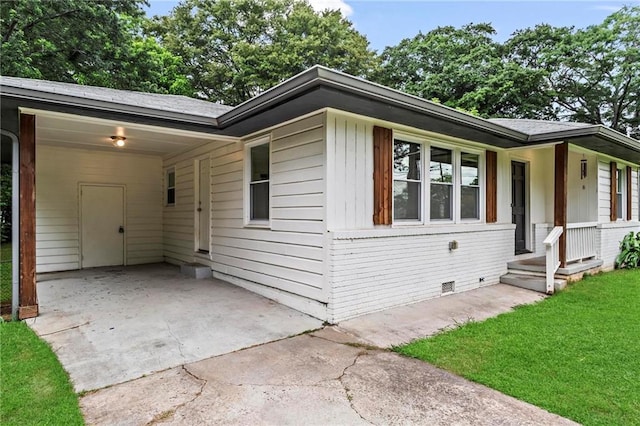 629 Dunton Cir SE, Smyrna, GA 30082 - ranch-style house featuring concrete driveway, a carport, a front lawn, and crawl space