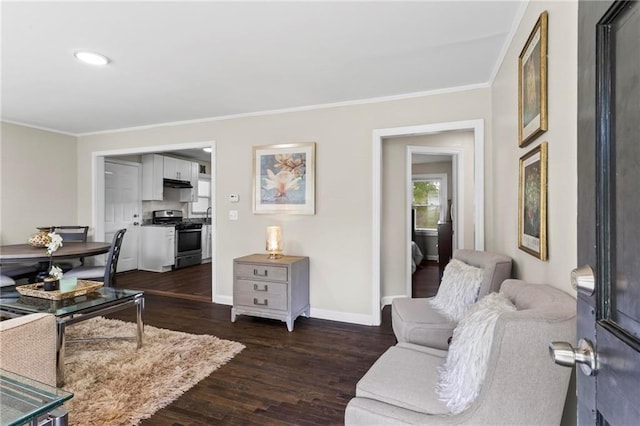 629 Dunton Cir SE, Smyrna, GA 30082 - living area featuring ornamental molding, dark wood-style floors, baseboards, and recessed lighting