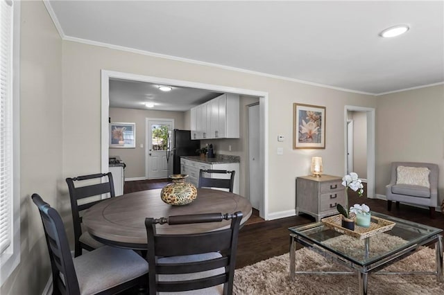 629 Dunton Cir SE, Smyrna, GA 30082 - dining area with baseboards, dark wood-style flooring, and crown molding