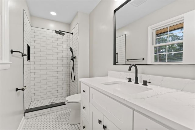 2002 Twin Falls Rd, Decatur, GA 30032 - bathroom featuring vanity, tiled shower, tile patterned floors, and recessed lighting