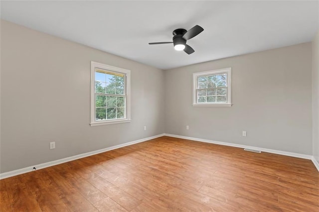 2002 Twin Falls Rd, Decatur, GA 30032 - unfurnished room featuring plenty of natural light, light wood-style floors, and ceiling fan