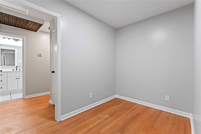 2002 Twin Falls Rd, Decatur, GA 30032 - spare room with light wood-style flooring and attic access
