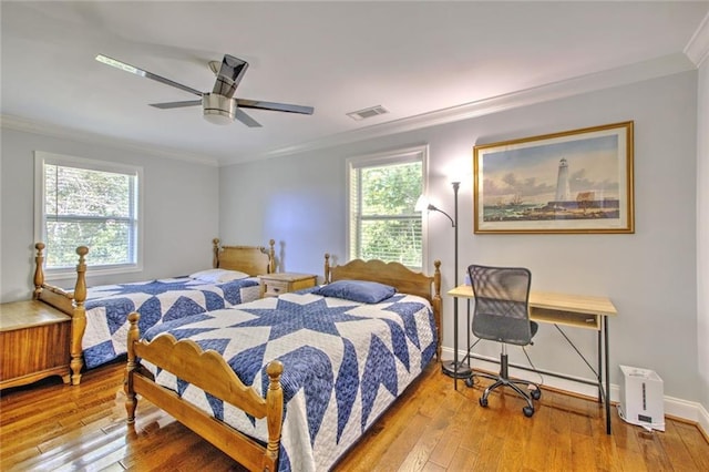 2944 Berry Rd, Loganville, GA 30052 - bedroom with visible vents, ornamental molding, baseboards, and hardwood / wood-style floors