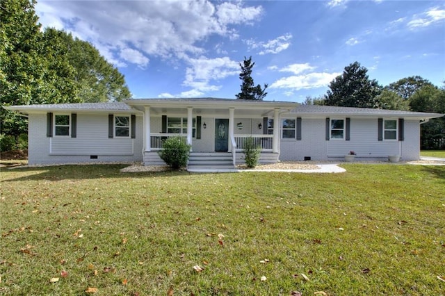 2944 Berry Rd, Loganville, GA 30052 - view of front of home with brick siding, crawl space, covered porch, and a front yard