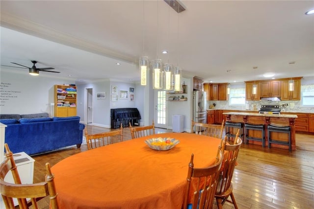 2944 Berry Rd, Loganville, GA 30052 - dining space with crown molding, recessed lighting, a ceiling fan, and light wood finished floors