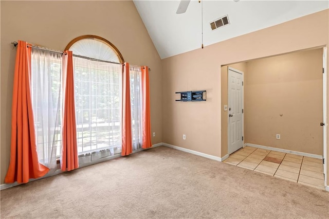 5340 Young Deer Dr, Cumming, GA 30041 - tiled empty room with carpet floors, ceiling fan, lofted ceiling, and baseboards