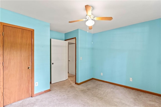 5340 Young Deer Dr, Cumming, GA 30041 - unfurnished bedroom featuring light colored carpet, baseboards, and ceiling fan