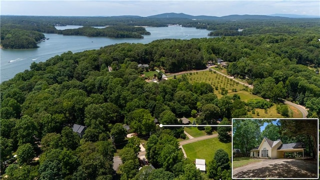 5340 Young Deer Dr, Cumming, GA 30041 - aerial view of property and surrounding area featuring a large body of water, a heavily wooded area, and property parcel outlined