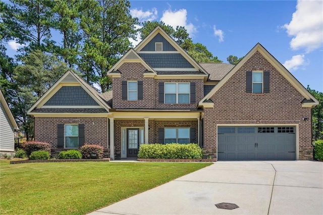 craftsman-style home featuring a garage and a front lawn