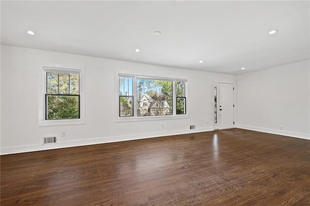 empty room with dark hardwood / wood-style floors