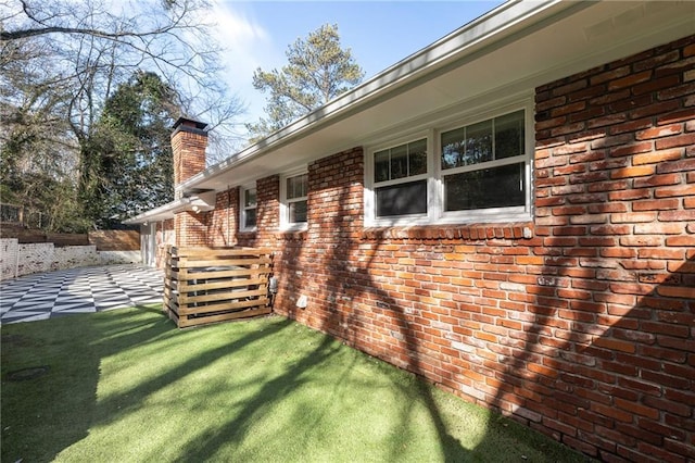 view of side of property featuring a yard