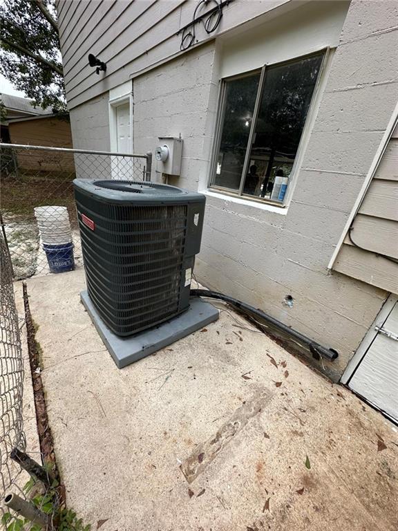 details with fence and cooling unit