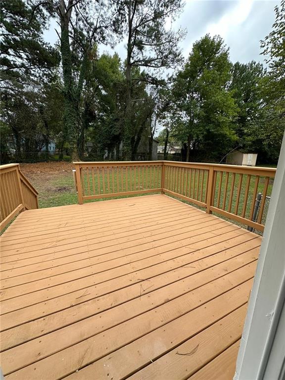 deck with a storage shed and an outdoor structure