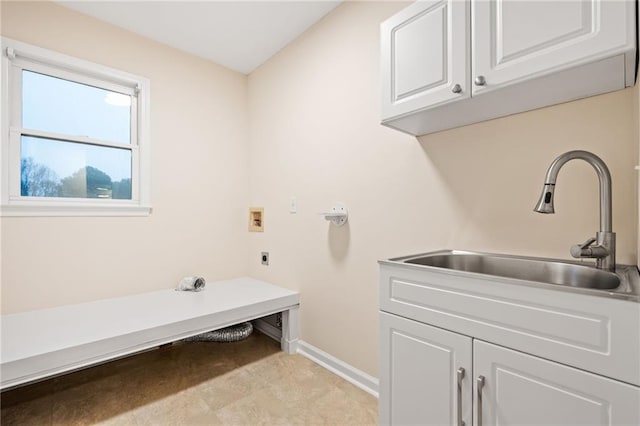 washroom with washer hookup, cabinets, sink, and electric dryer hookup