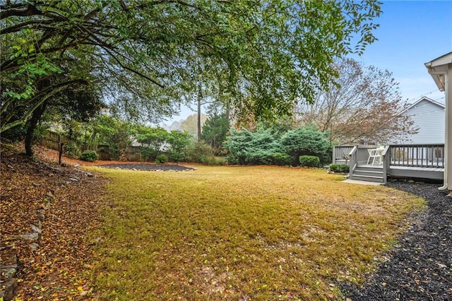 view of yard featuring a wooden deck