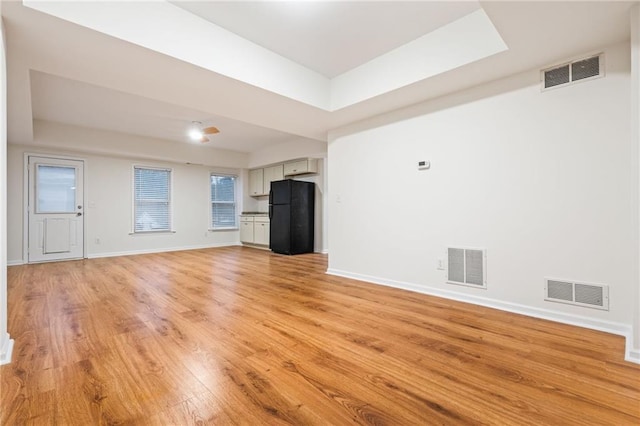 unfurnished living room with light hardwood / wood-style flooring