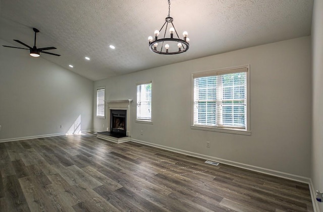 515 Allens Landing Ct, Lawrenceville, GA 30045 - unfurnished living room featuring a textured ceiling, dark wood-type flooring, recessed lighting, a chandelier, and a fireplace with raised hearth