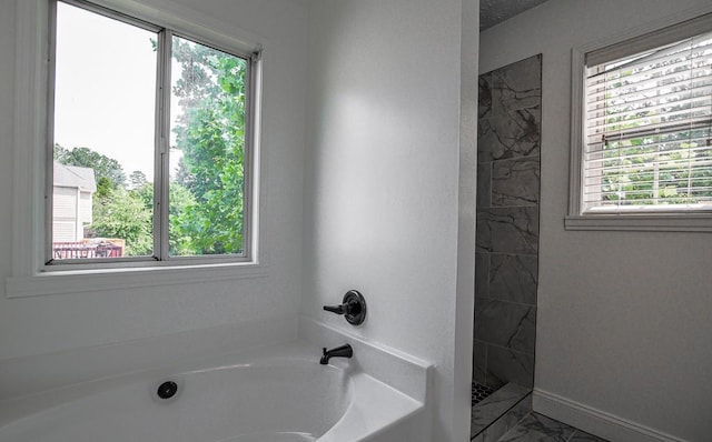 515 Allens Landing Ct, Lawrenceville, GA 30045 - full bath featuring a bath, healthy amount of natural light, a marble finish shower, and marble look tile flooring