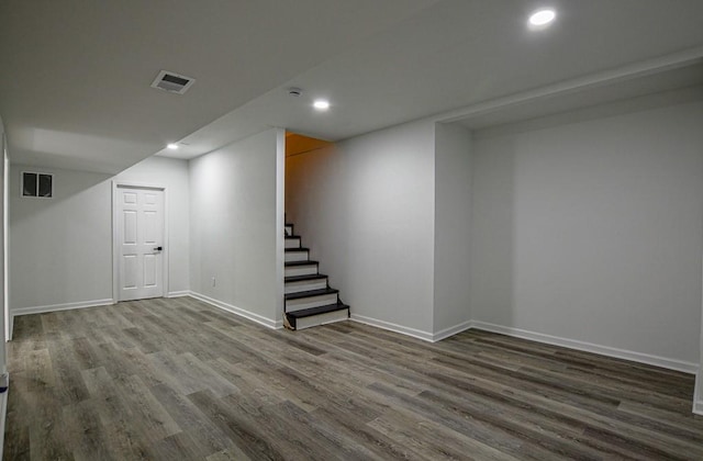 515 Allens Landing Ct, Lawrenceville, GA 30045 - finished basement featuring wood finished floors, stairway, baseboards, and recessed lighting