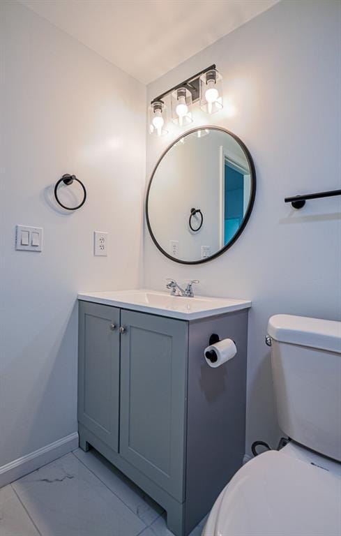 515 Allens Landing Ct, Lawrenceville, GA 30045 - bathroom featuring vanity, marble finish floors, toilet, and baseboards