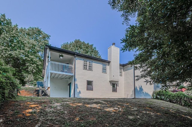 515 Allens Landing Ct, Lawrenceville, GA 30045 - rear view of property featuring a balcony and a chimney