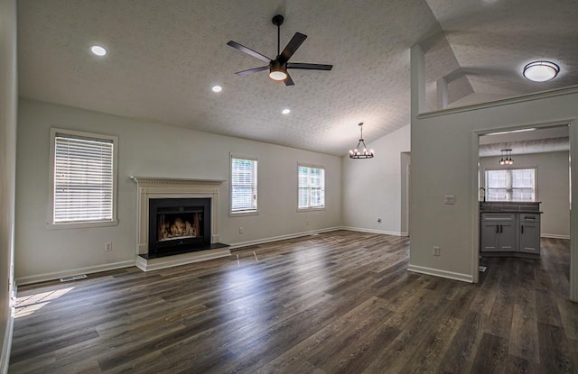 515 Allens Landing Ct, Lawrenceville, GA 30045 - unfurnished living room with a textured ceiling, a fireplace with raised hearth, vaulted ceiling, healthy amount of natural light, and ceiling fan