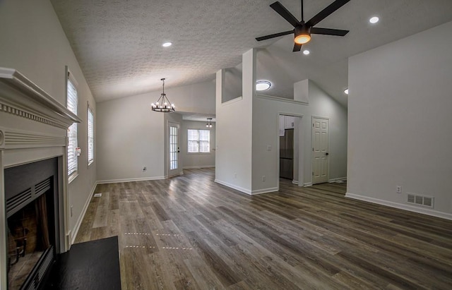 515 Allens Landing Ct, Lawrenceville, GA 30045 - unfurnished living room with a fireplace, dark wood finished floors, a ceiling fan, vaulted ceiling, and a chandelier