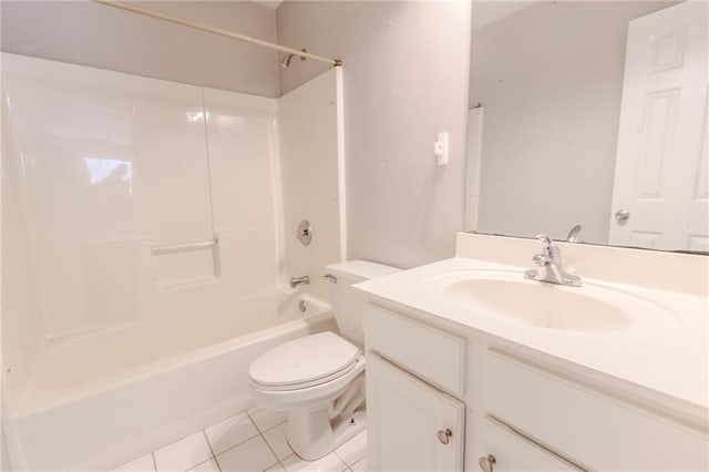 full bathroom with vanity, tile patterned floors, toilet, and washtub / shower combination