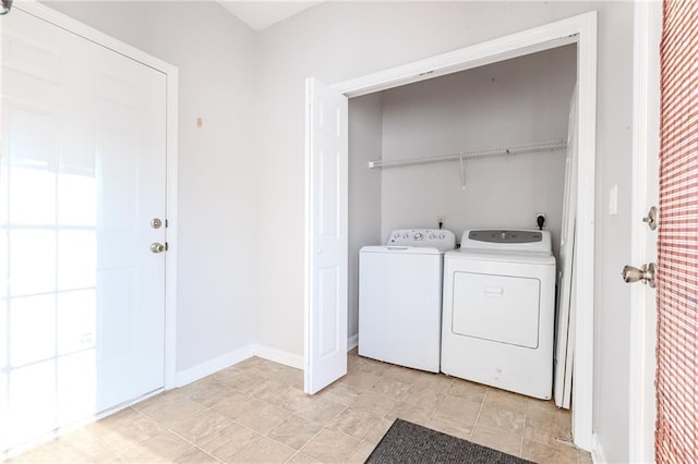 laundry room with washing machine and dryer