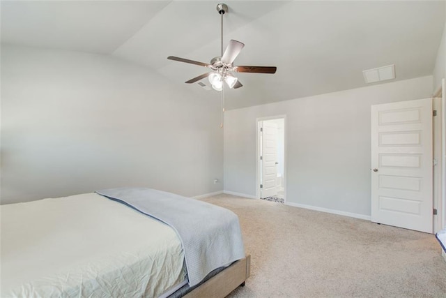 bedroom with carpet floors, visible vents, vaulted ceiling, ceiling fan, and baseboards