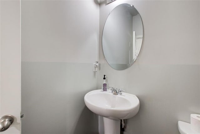 bathroom with a sink and toilet