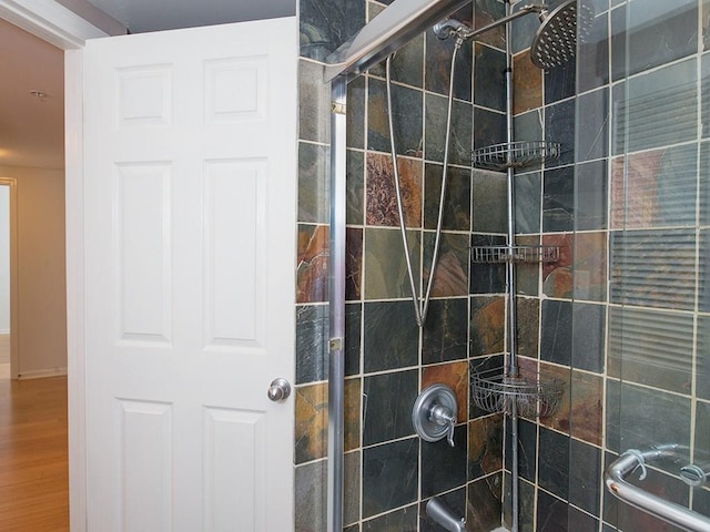 bathroom with a shower with shower door