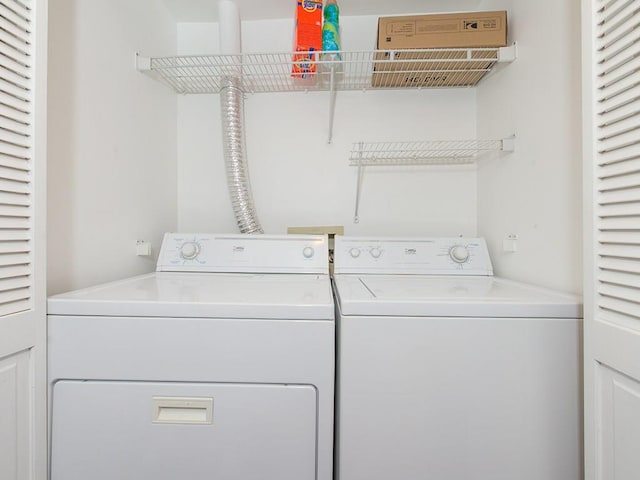 laundry room featuring washing machine and dryer