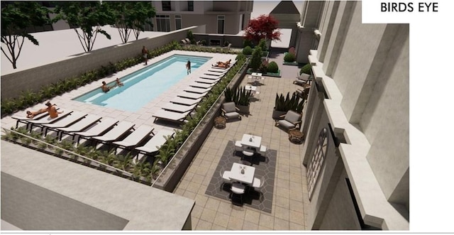 view of swimming pool with a patio area