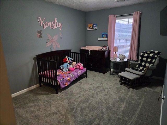 carpeted bedroom with a textured ceiling