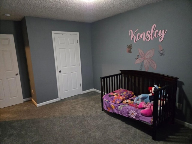 bedroom featuring carpet floors and a textured ceiling