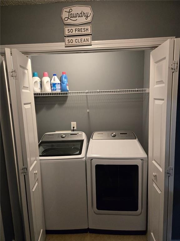 washroom featuring independent washer and dryer