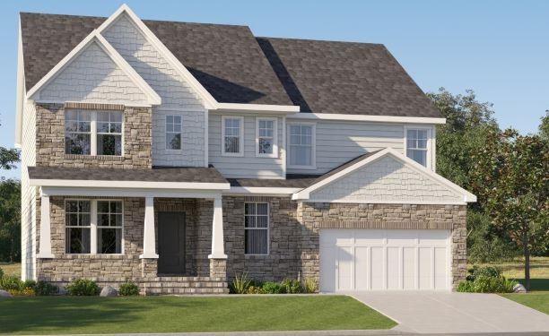 view of front facade featuring a garage and a front yard