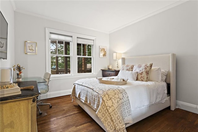 bedroom featuring ornamental molding, baseboards, and wood finished floors