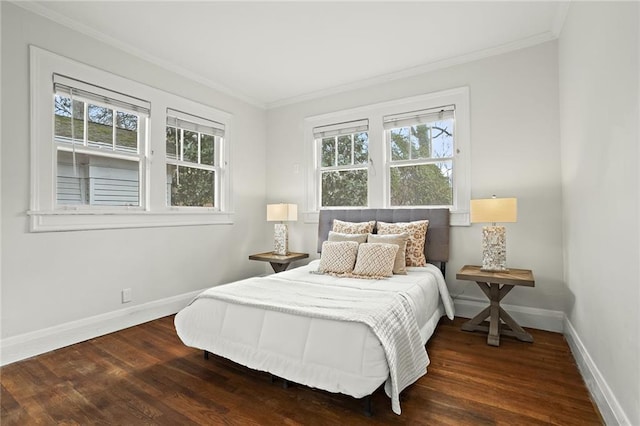 bedroom featuring dark wood-style flooring, multiple windows, and baseboards