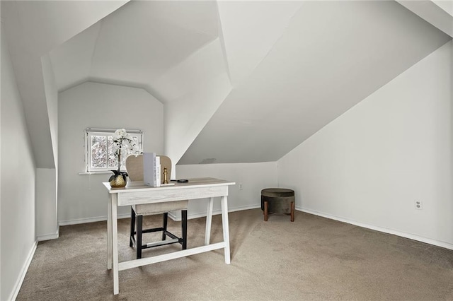 office area with carpet floors, vaulted ceiling, and baseboards