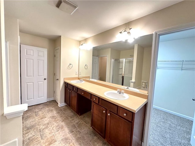 bathroom with vanity and an enclosed shower