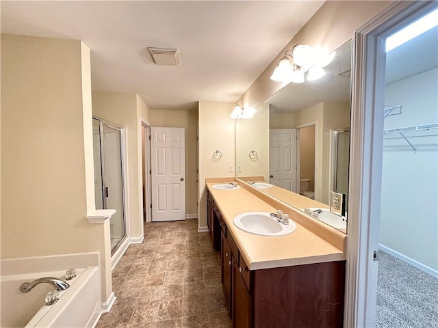 bathroom featuring vanity and separate shower and tub