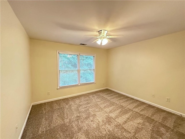 unfurnished room with carpet flooring and ceiling fan