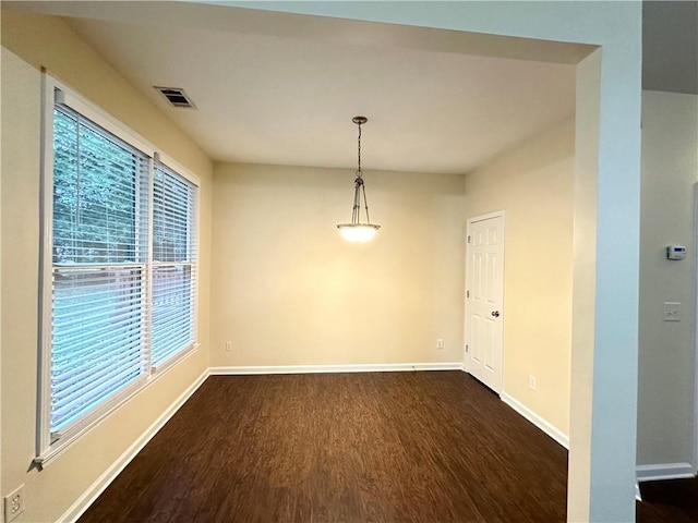 spare room with dark hardwood / wood-style floors