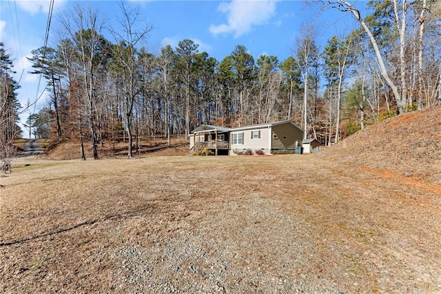 view of yard with a wooden deck