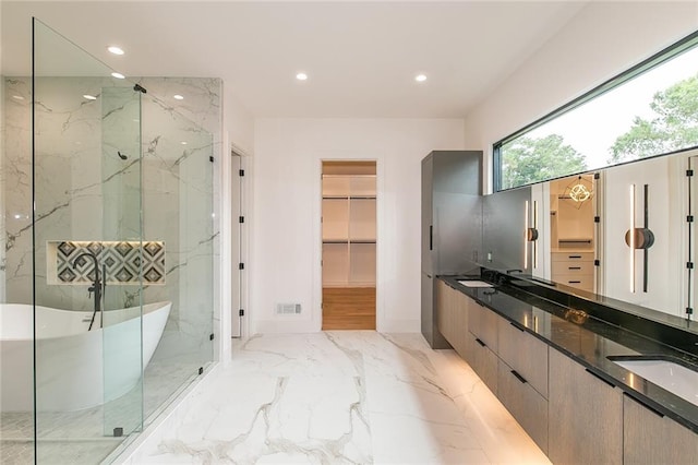 bathroom with vanity and plus walk in shower