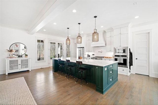 kitchen featuring tasteful backsplash, green cabinets, white cabinets, appliances with stainless steel finishes, and recessed lighting